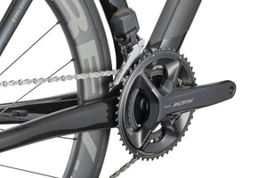 Close-up of the Masi EVOLUZIONE 1 Carbon drivetrain with a Shimano 105 crankset, chainring, and aerodynamic design.