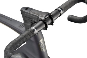 Close-up of a black EVOLUZIONE 1 handlebar with textured grips and BREAKR stem, highlighting its high-performance aerodynamic design.