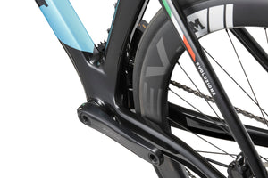 Close-up of a sleek black and blue Masi EVOLUZIONE 1 Carbon frame, highlighting its aero design, rear wheel, gears, and chain.