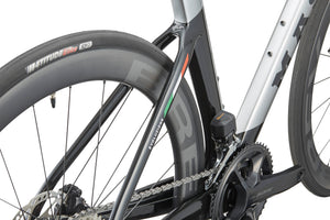 Close-up of the rear wheel and chain of a Masi EVOLUZIONE 1 showing its aerodynamic design with colorful stripes and branded components.