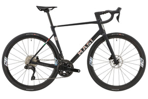 The GRAN CORSA carbon road bike, black with drop handlebars and thin tires, is shown in side profile on a white background.