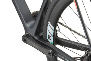 Close-up of the GRAN CORSA carbon road bike frame and rear wheel, highlighting the crank arm, chain, and tire details.
