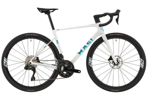 White GRAN CORSA carbon road bike with black wheels, drop handlebars, and blue MAST logo on the frame, shown from the side.