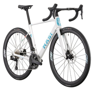 White GRAN CORSA carbon road bike with drop handlebars, black wheels, and GRAN CORSA branding, rear side angle.