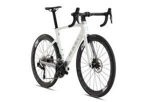 The EVOLUZIONE 1 by Masi Bikes is a sleek carbon road bike with an aerodynamic design, drop handlebars, disc brakes, and large black wheels with sporty rims. The Masi logo is prominently displayed on the frame against a pristine white background.